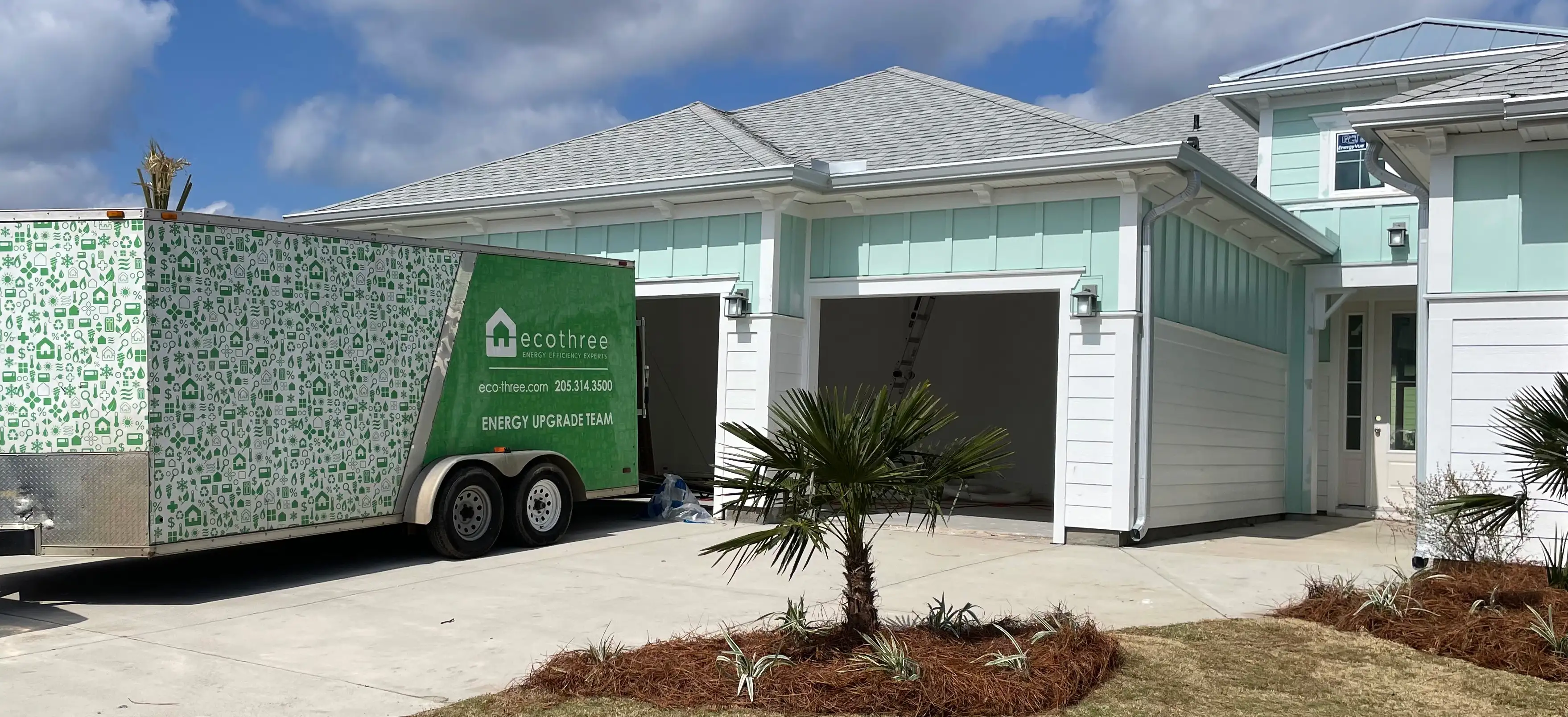Eco Three van parked out front of a client's home